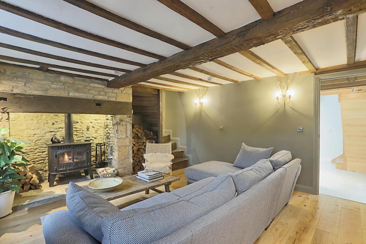 Living room with beams and wood burner